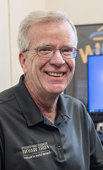 Mike Slaubaugh is sitting in front of his computer